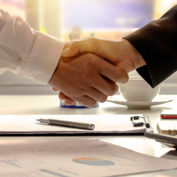 handshake after signature of a legal document